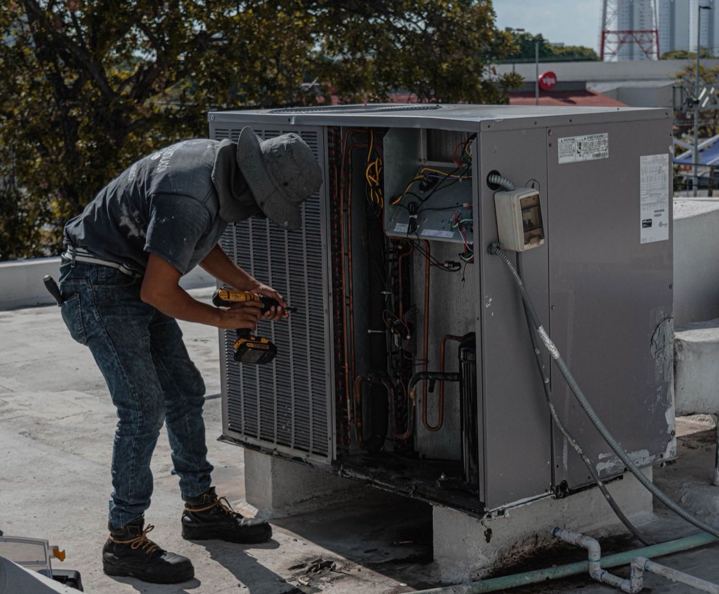 Technician servicing a packaged unit